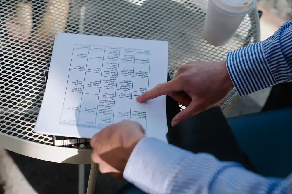 Business owner and cleaning professional reviewing a schedule