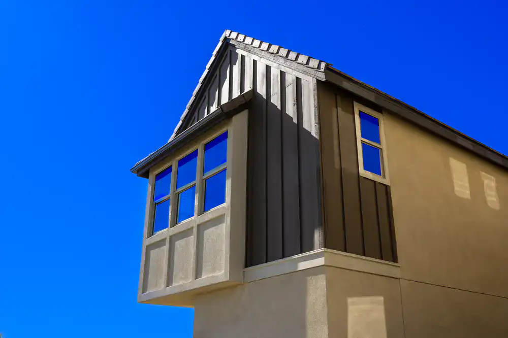 Clean residential windows reflecting the sky