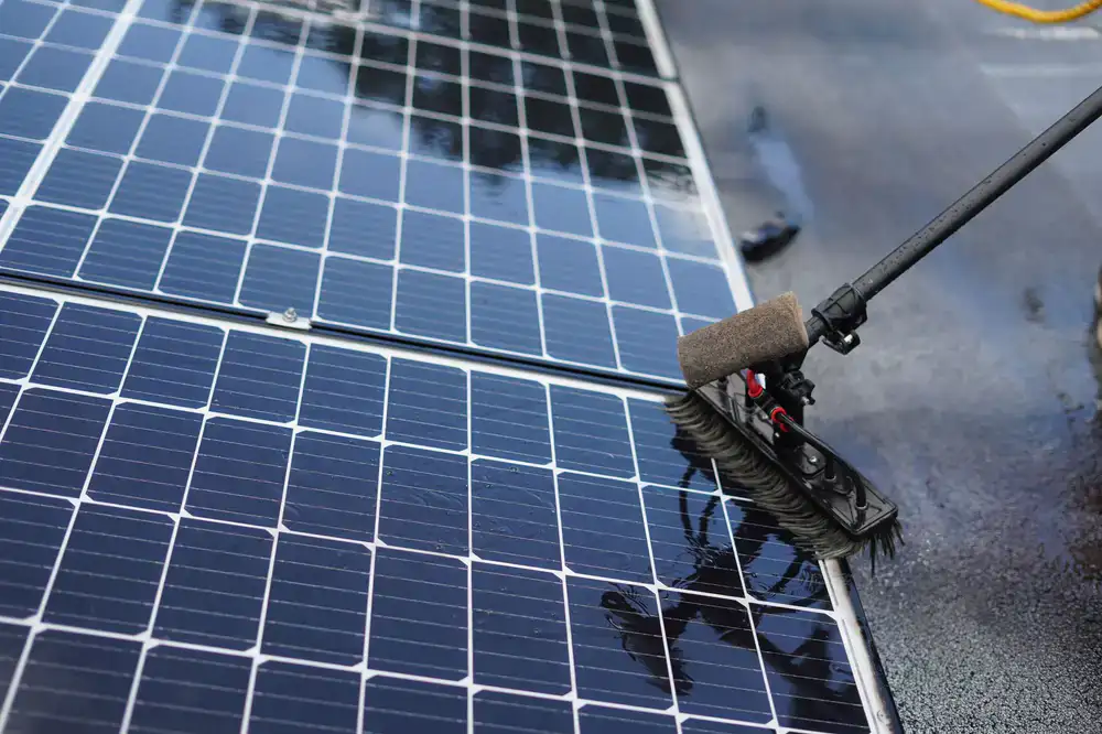 Washing a solar panel on a rooftop